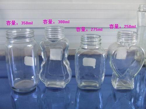 廠家供應多種規(guī)格蜂蜜玻璃瓶，配套瓶蓋