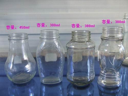 廠家供應多種規(guī)格蜂蜜玻璃瓶，配套瓶蓋