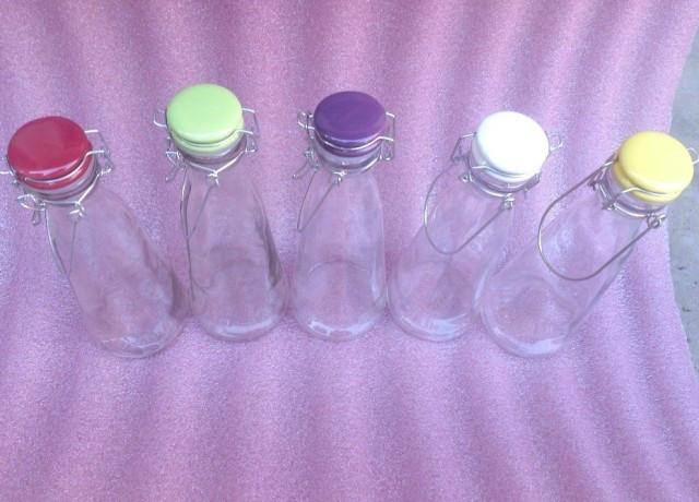 供應(yīng)提手奶瓶玻璃飲料瓶批發(fā)多少錢